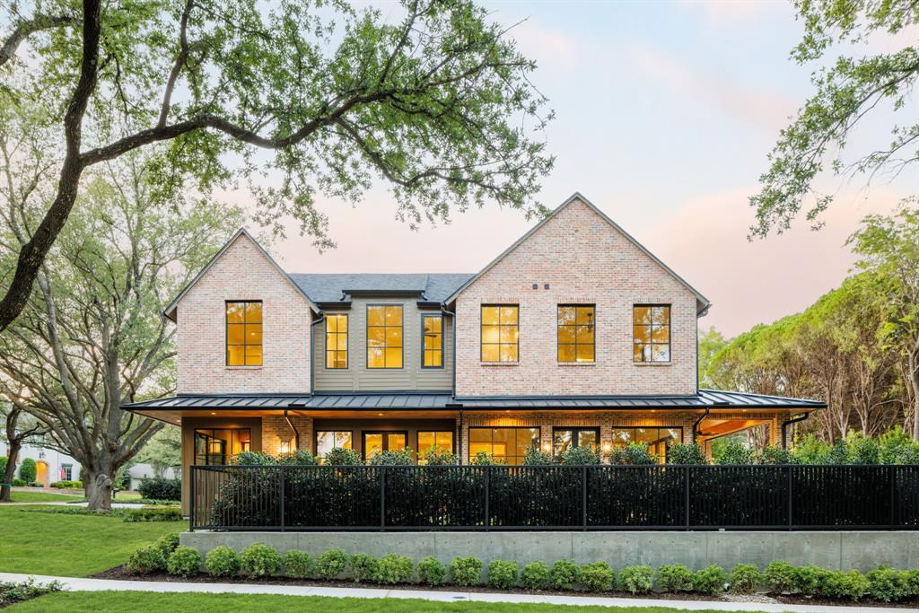 3944 Dalgreen Drive Dallas, TX 75214 - Photo 36 of 38 a front view of a house with a yard and garage