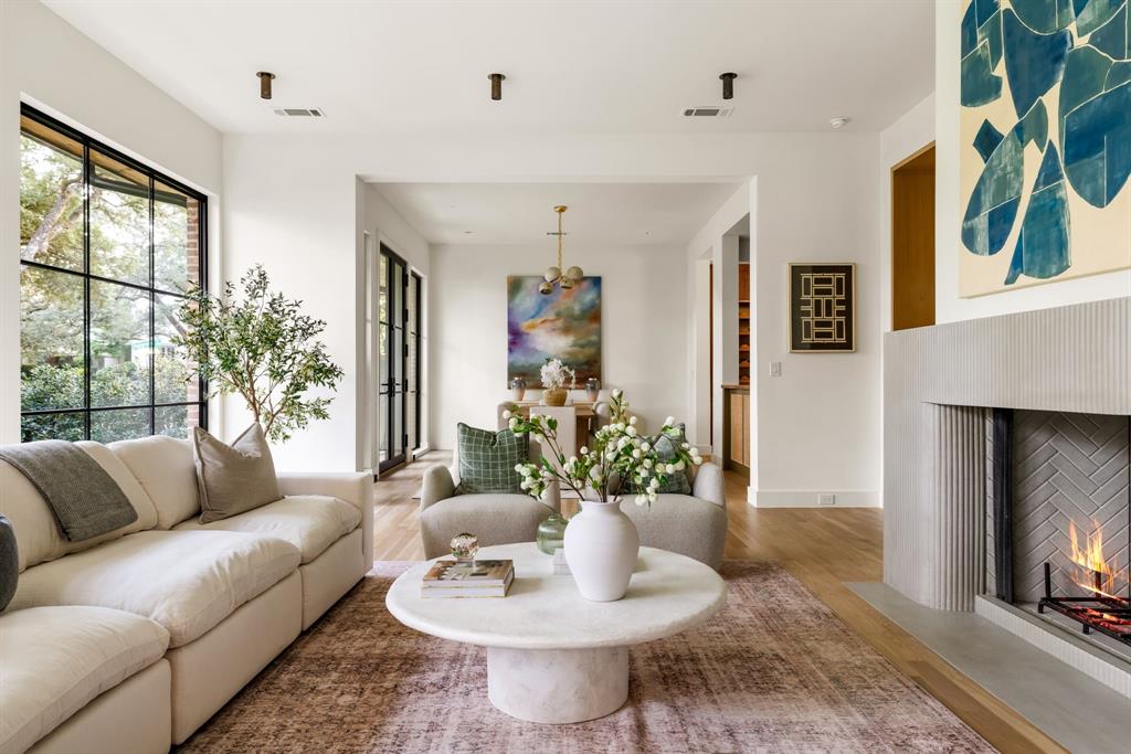 3944 Dalgreen Drive Dallas, TX 75214 - Photo 9 of 38 a living room with furniture and a fireplace