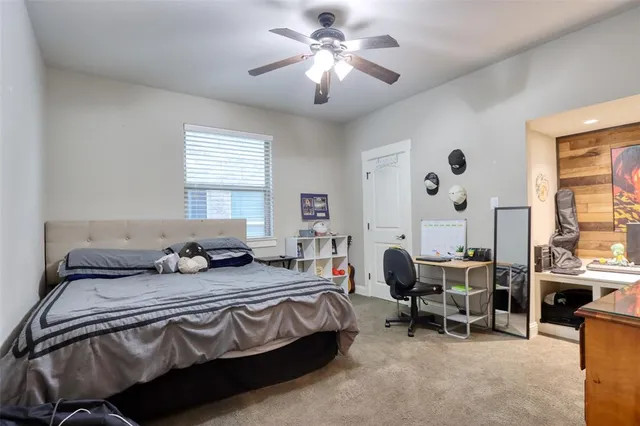 a bedroom with bed and a window