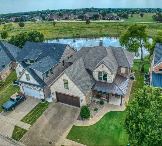 an aerial view of a house with a garden