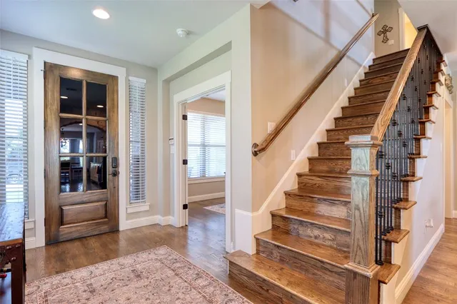 a view of staircase with white walls and windows