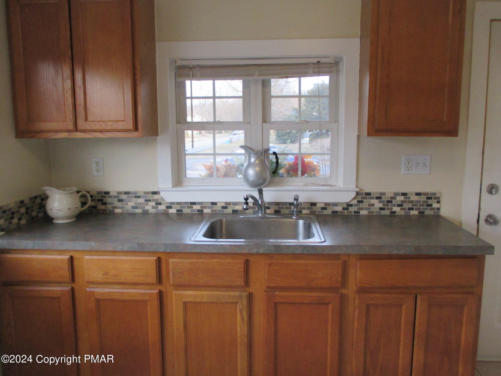 128 Broad Street Stroudsburg, PA 18360 - Photo 13 of 18 a kitchen with a sink and cabinets