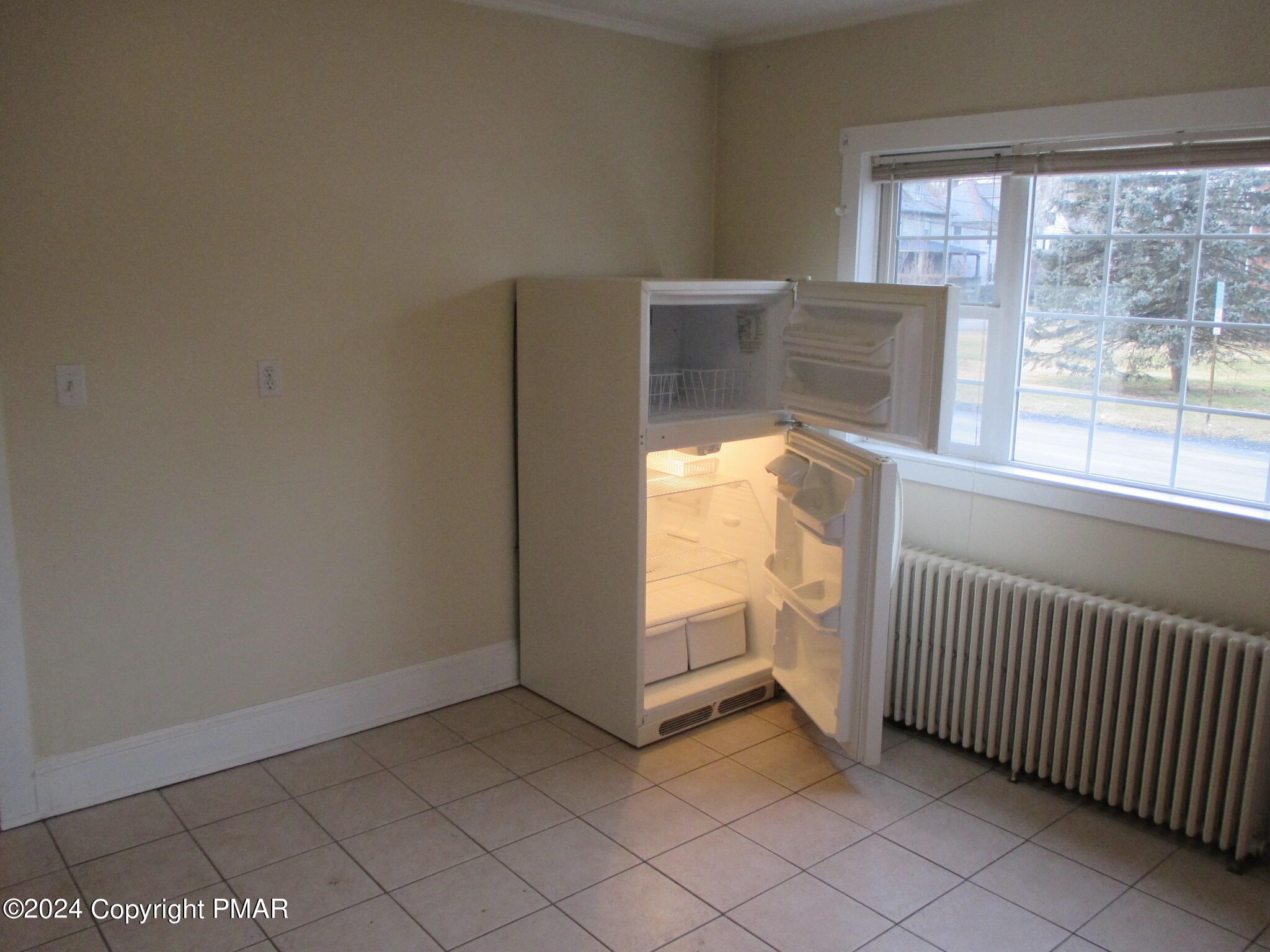 128 Broad Street Stroudsburg, PA 18360 - Photo 16 of 18 a view of an empty room with a window