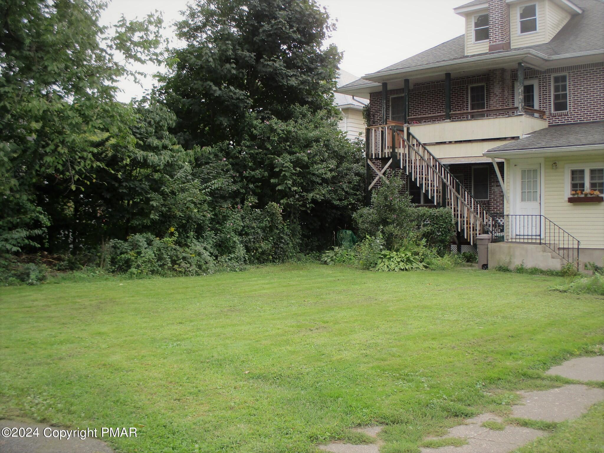 128 Broad Street Stroudsburg, PA 18360 - Photo 17 of 18 a house view with a garden space