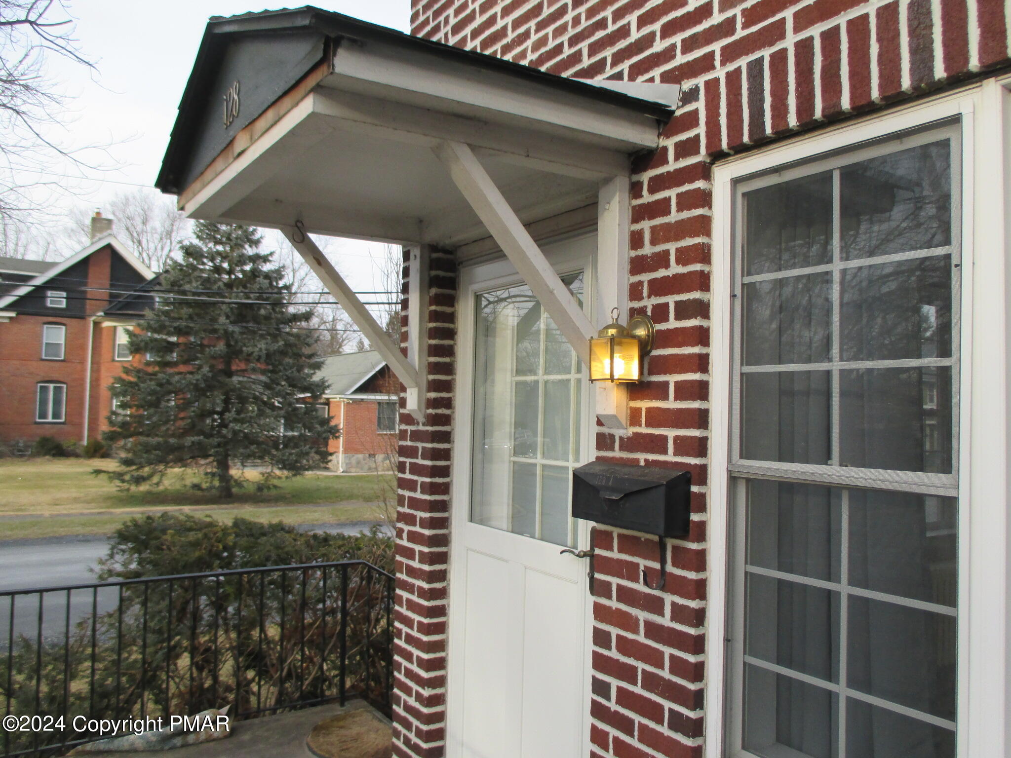128 Broad Street Stroudsburg, PA 18360 - Photo 3 of 18 a front view of a house with a yard