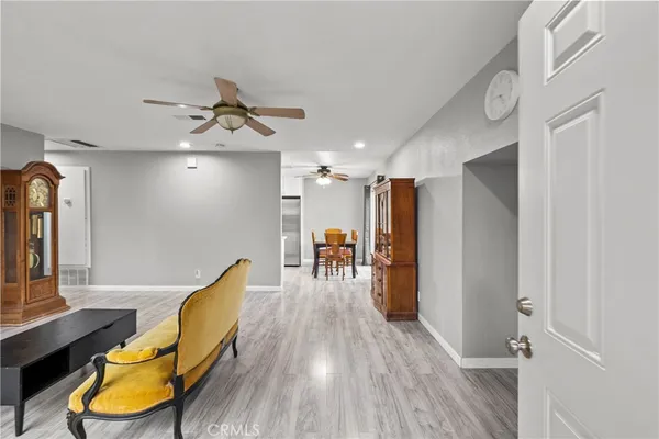 a view of a livingroom with furniture and wooden floor