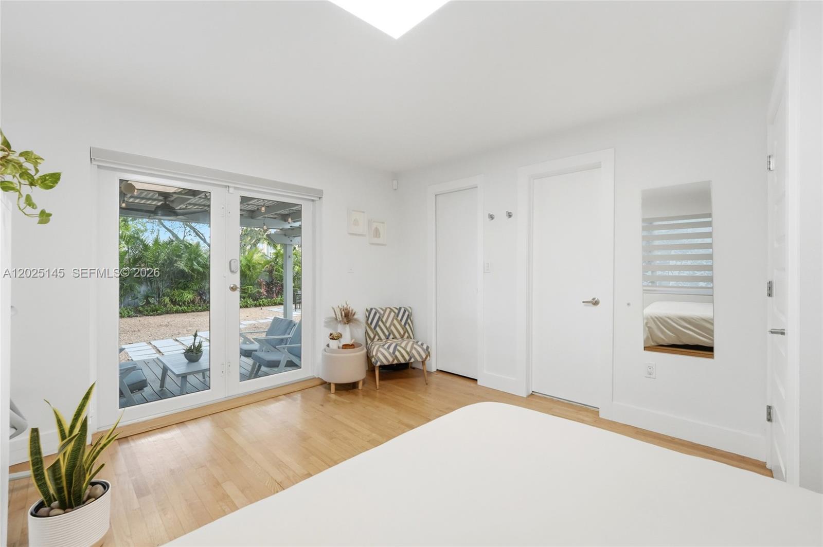 3101 Southwest 25th Terrace Miami, FL 33133 - Photo 14 of 31 a bedroom with a bed and wooden floor