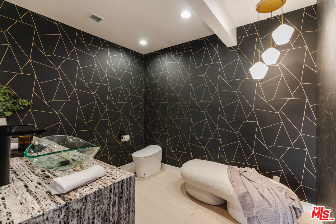 1666 Summitridge Drive Beverly Hills, CA 90210 - Photo 13 of 39 a bathroom with a toilet and a shower