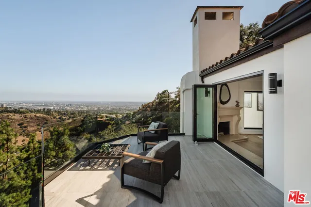 a view of a couches in the balcony