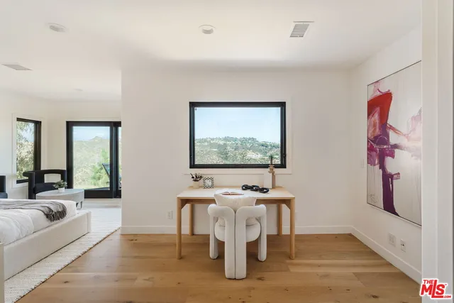 a living room with furniture and flat screen tv