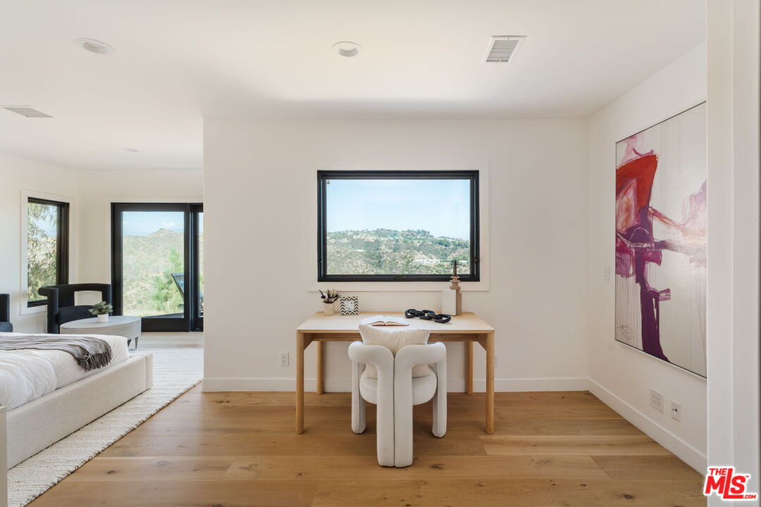 1666 Summitridge Drive Beverly Hills, CA 90210 - Photo 24 of 39 a living room with furniture and flat screen tv