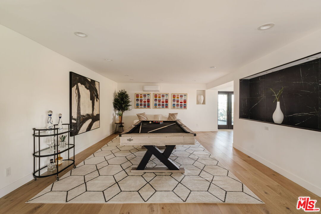 1666 Summitridge Drive Beverly Hills, CA 90210 - Photo 29 of 39 a living room with furniture