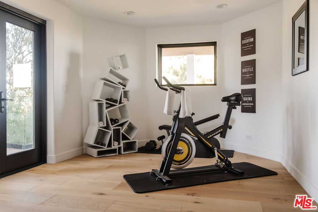 1666 Summitridge Drive Beverly Hills, CA 90210 - Photo 30 of 39 a view of a room with gym equipment