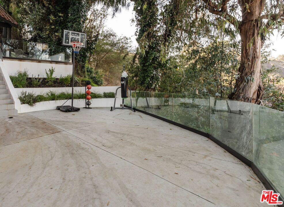 1666 Summitridge Drive Beverly Hills, CA 90210 - Photo 31 of 39 a view of outdoor space with deck and tree