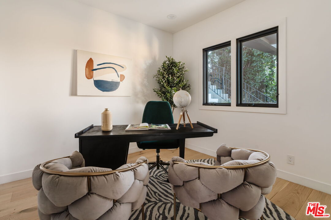 1666 Summitridge Drive Beverly Hills, CA 90210 - Photo 33 of 39 a living room with furniture