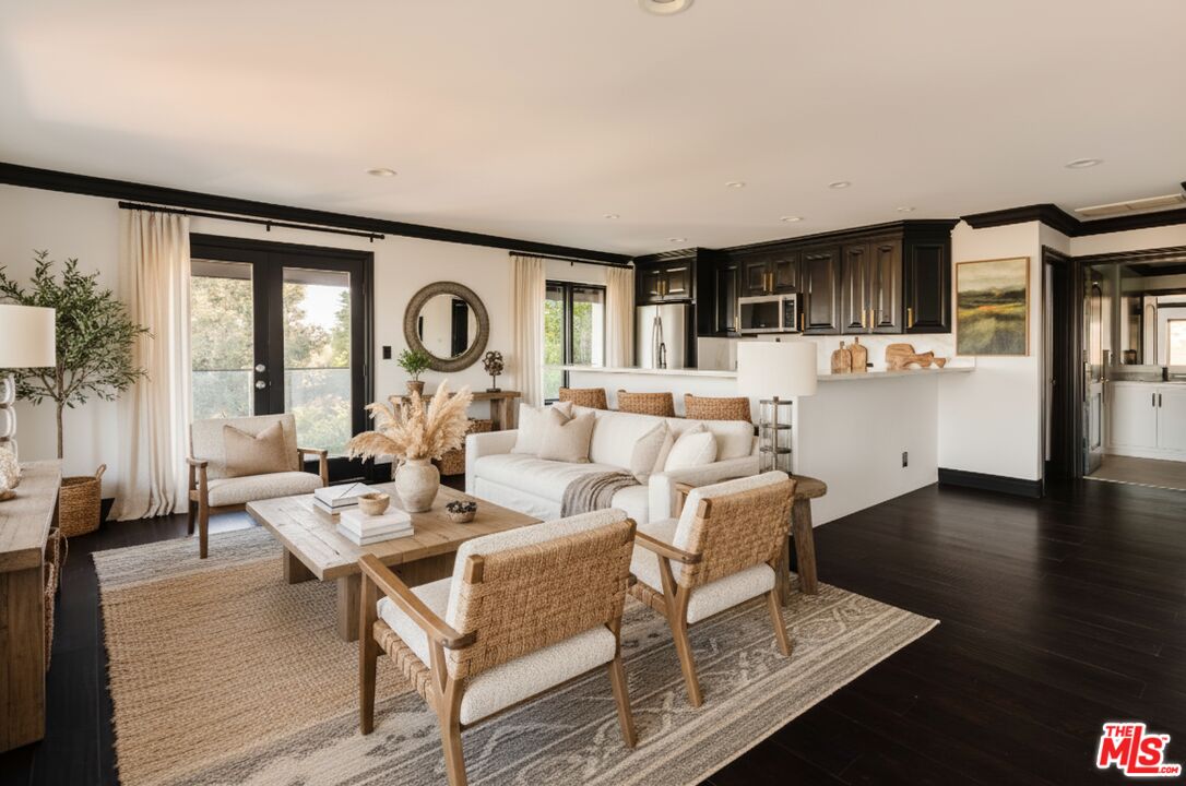 1666 Summitridge Drive Beverly Hills, CA 90210 - Photo 36 of 39 a living room with fireplace furniture and a large window