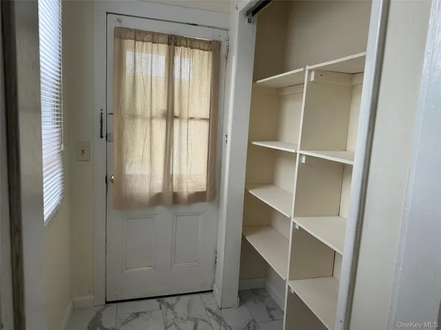 a view of an empty walk in closet
