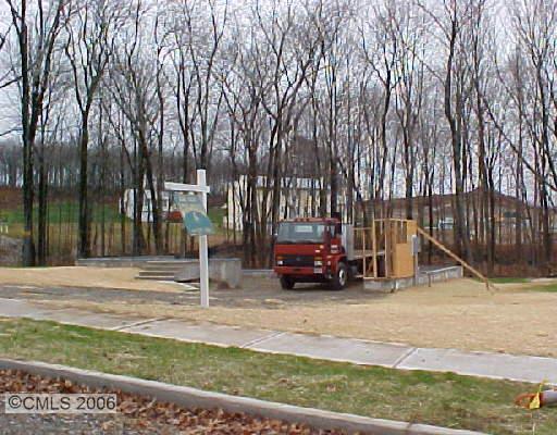 223 Osborn Road, Unit 18 Naugatuck, CT 06770 - Photo 1 of 1 a view of street with parked cars