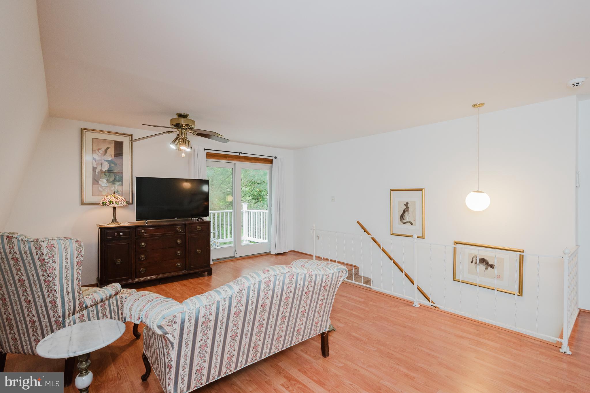 710 Magnolia Road Joppa, MD 21085 - Photo 23 of 58 a living room with furniture and a flat screen tv
