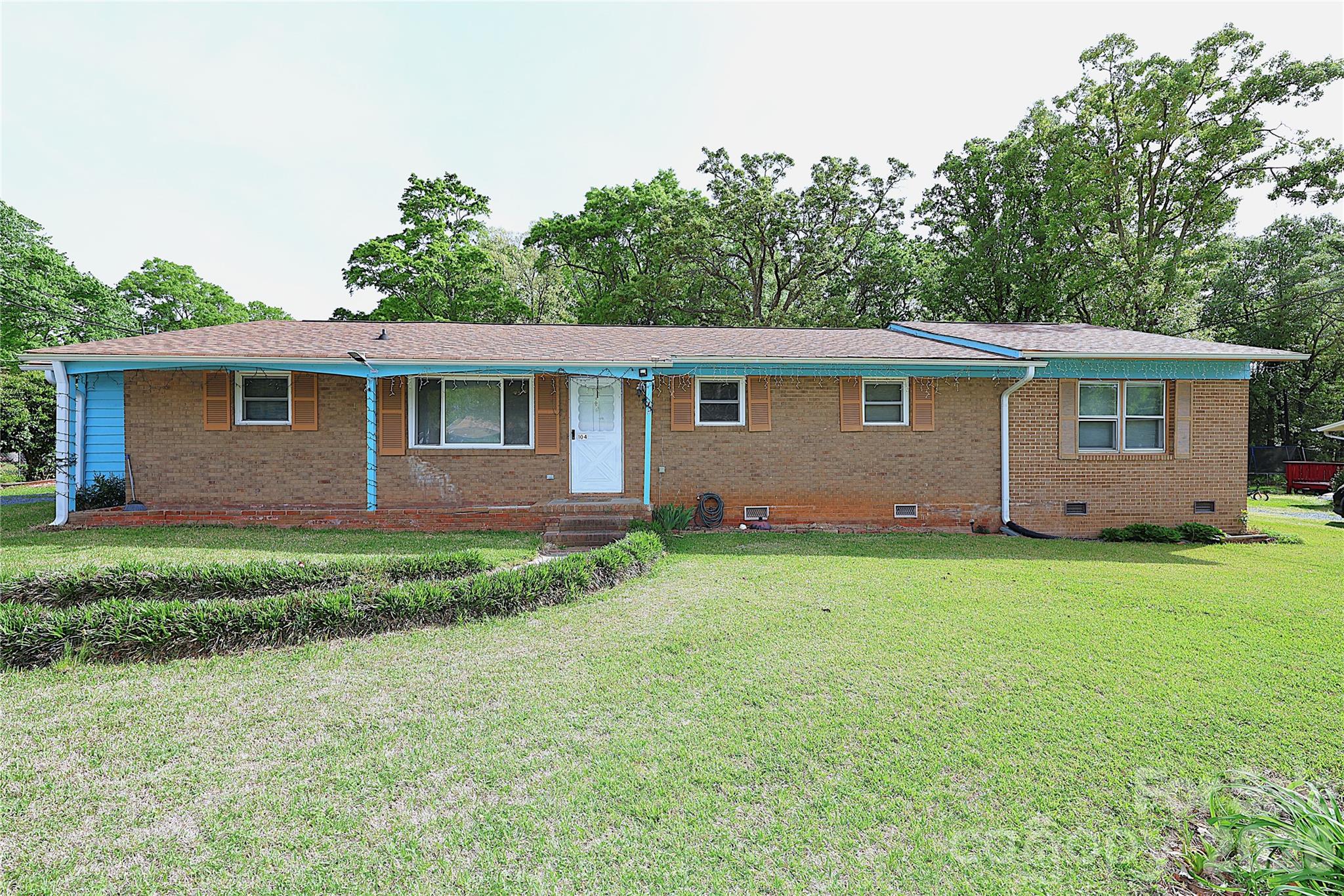 104 Pinetree Drive Matthews, NC 28104 - Photo 1 of 6 a view of backyard of house with green space