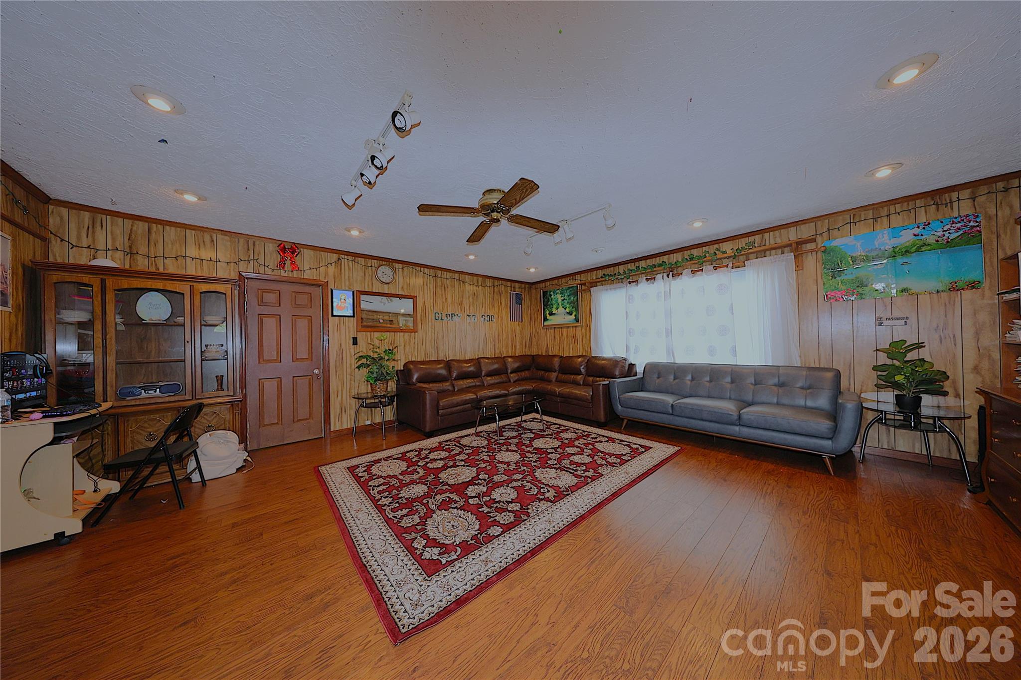 104 Pinetree Drive Matthews, NC 28104 - Photo 2 of 6 a living room with furniture and a rug