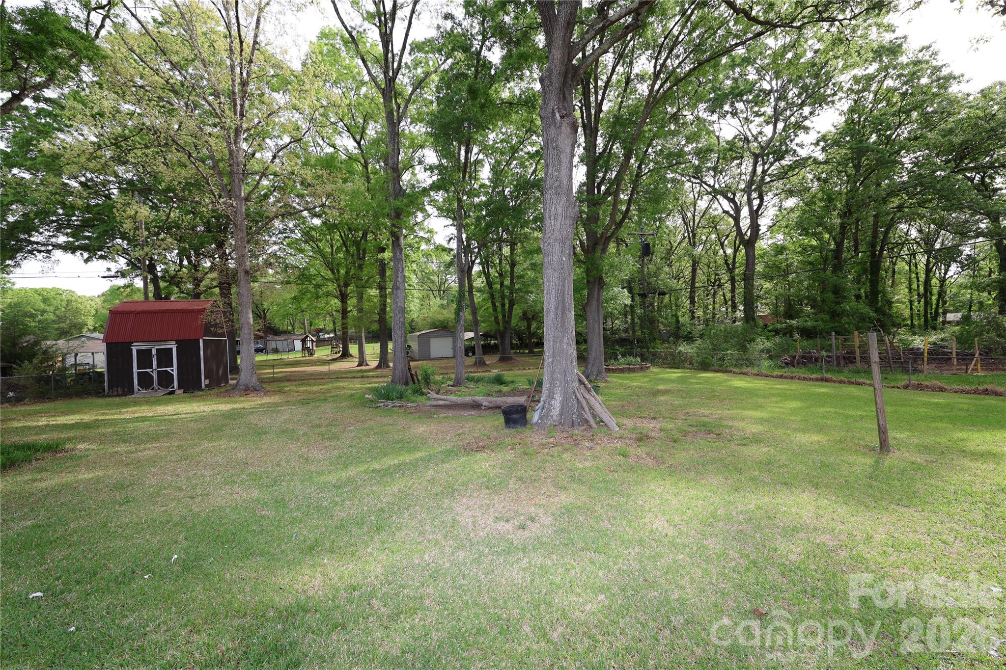 104 Pinetree Drive Matthews, NC 28104 - Photo 5 of 6 a view of a house with a backyard