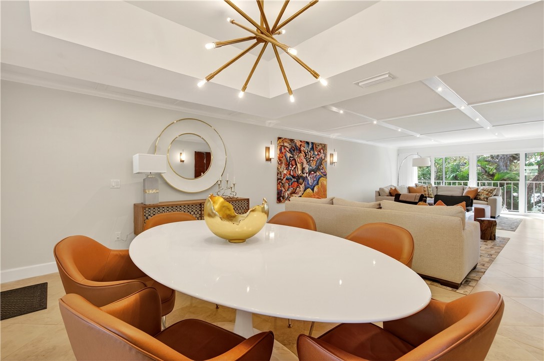 2743 Ocean Drive, Unit 50E Vero Beach, FL 32963 - Photo 11 of 36 a living room with furniture and a clock