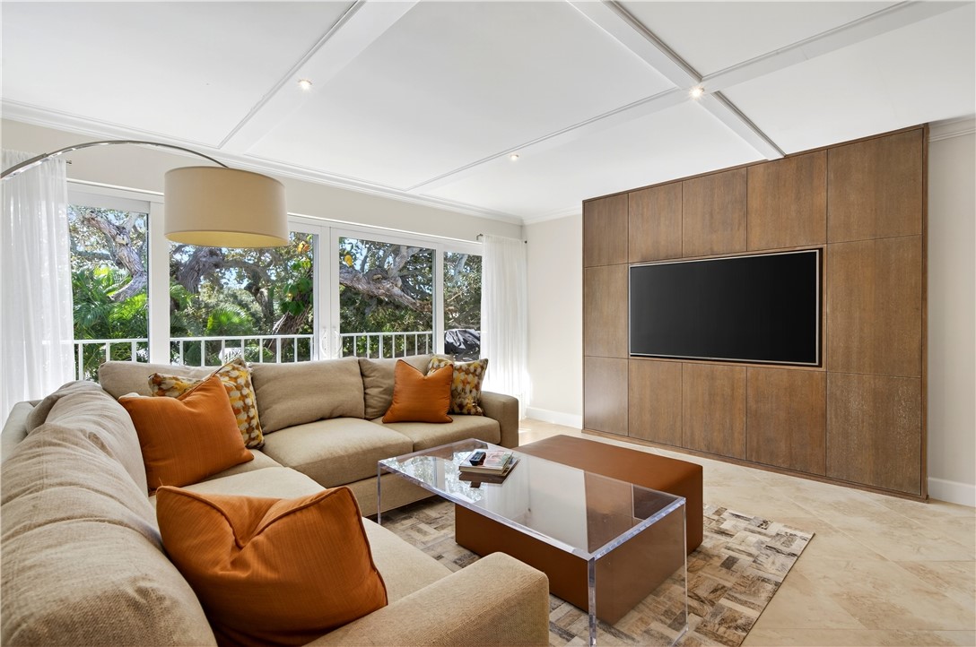 2743 Ocean Drive, Unit 50E Vero Beach, FL 32963 - Photo 12 of 36 a living room with furniture and a flat screen tv
