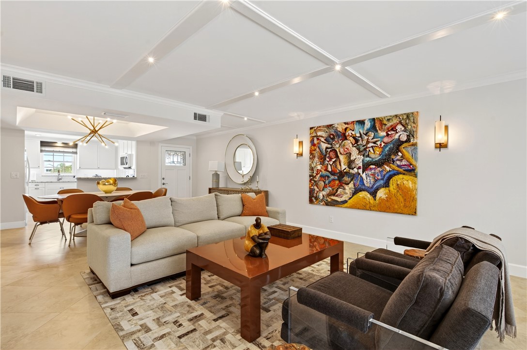 2743 Ocean Drive, Unit 50E Vero Beach, FL 32963 - Photo 13 of 36 a living room with furniture a rug and a window
