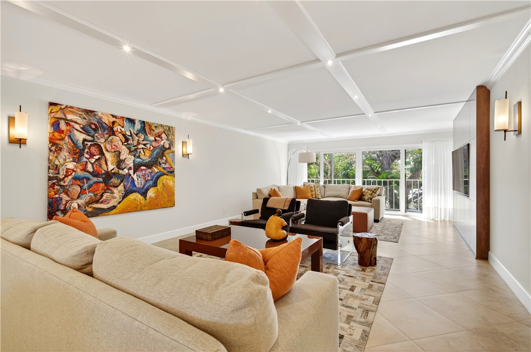 2743 Ocean Drive, Unit 50E Vero Beach, FL 32963 - Photo 16 of 36 a living room with furniture a couch and a large window