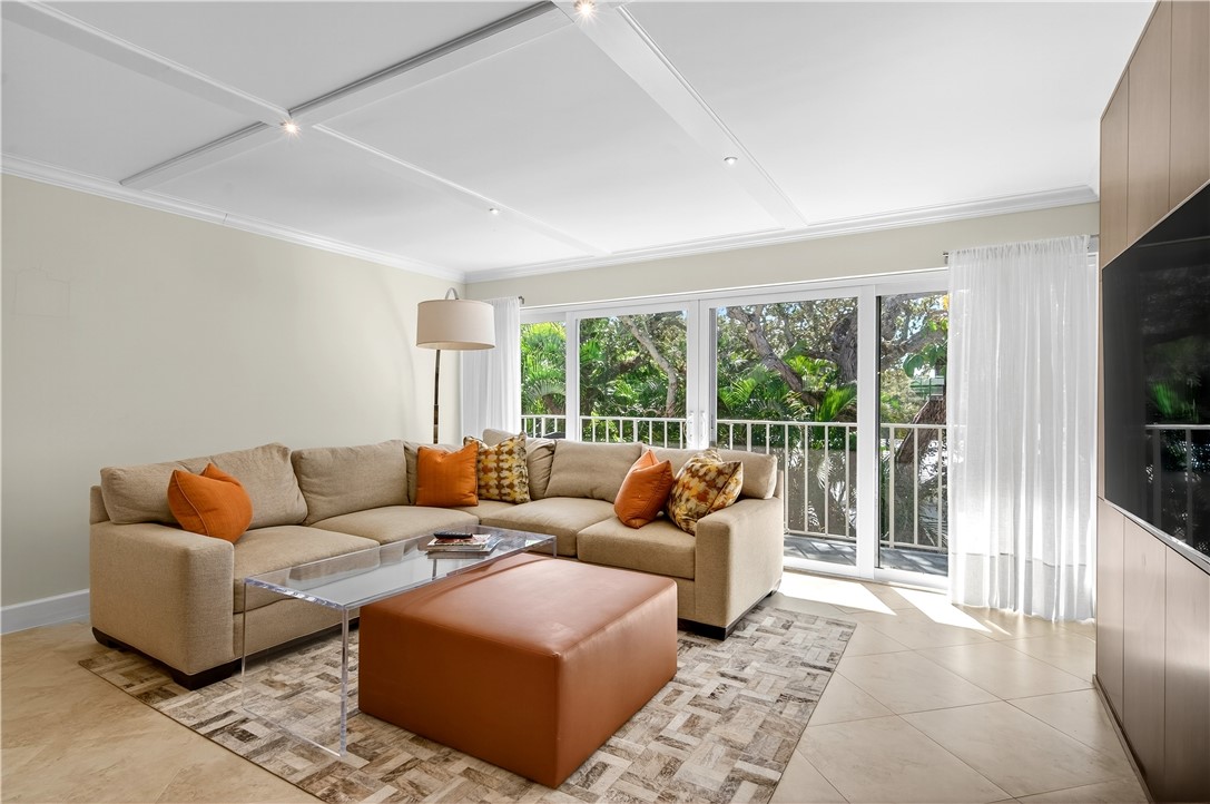 2743 Ocean Drive, Unit 50E Vero Beach, FL 32963 - Photo 17 of 36 a living room with furniture and a flat screen tv