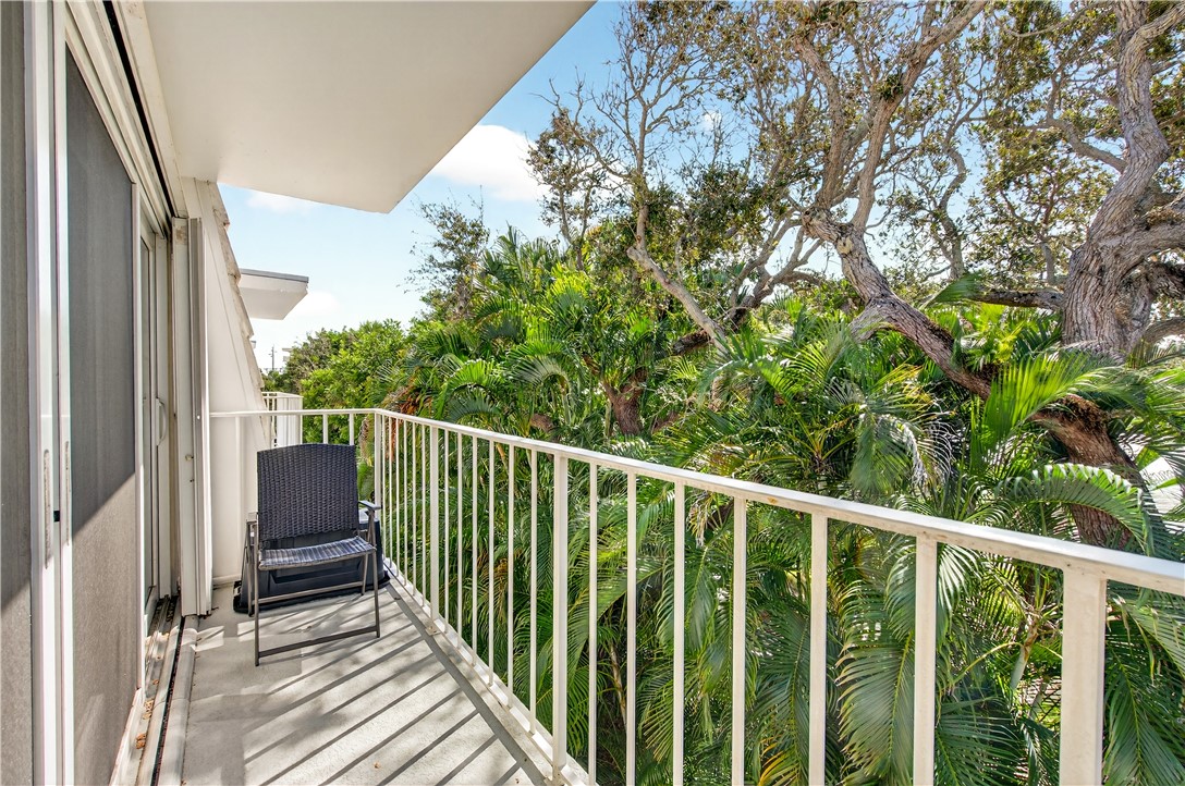 2743 Ocean Drive, Unit 50E Vero Beach, FL 32963 - Photo 19 of 36 a view of a balcony with wooden floor