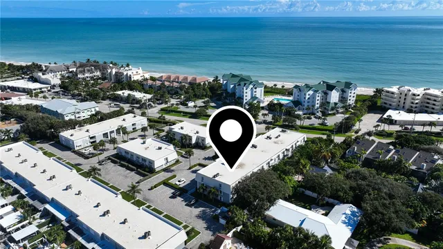 a dining room with furniture and a painting