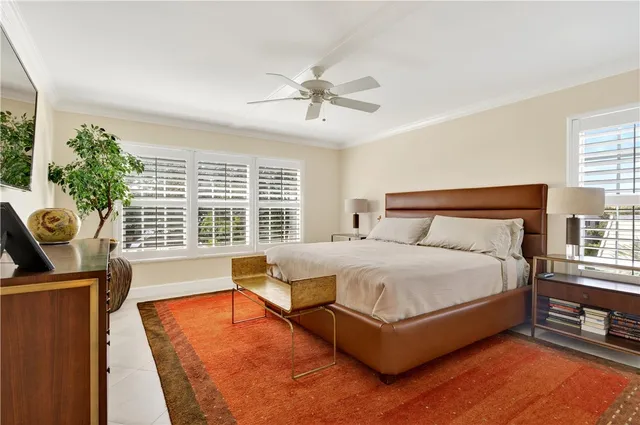 a bedroom with furniture and a window