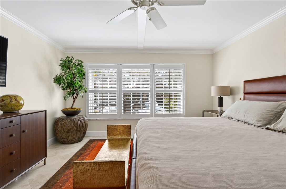 2743 Ocean Drive, Unit 50E Vero Beach, FL 32963 - Photo 22 of 36 a bedroom with furniture and a window