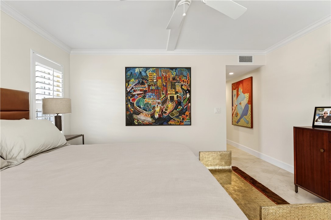 2743 Ocean Drive, Unit 50E Vero Beach, FL 32963 - Photo 23 of 36 a bedroom with a bed and a couch