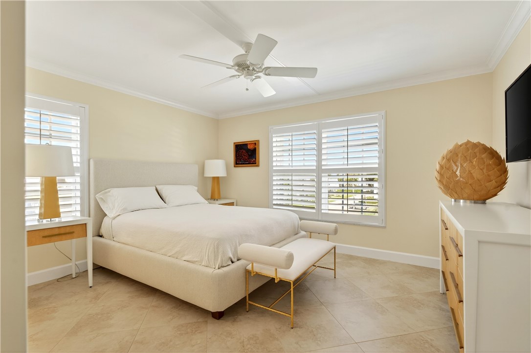 2743 Ocean Drive, Unit 50E Vero Beach, FL 32963 - Photo 25 of 36 a bedroom with a bed and window