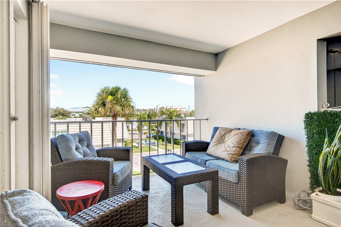 2743 Ocean Drive, Unit 50E Vero Beach, FL 32963 - Photo 29 of 36 a living room with furniture and a floor to ceiling window