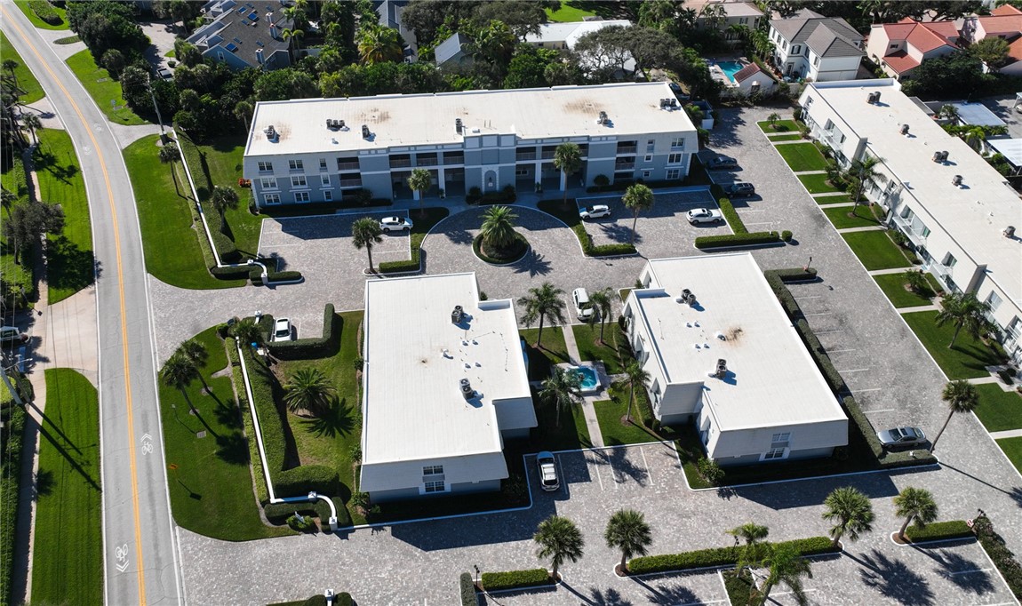 2743 Ocean Drive, Unit 50E Vero Beach, FL 32963 - Photo 32 of 36 an aerial view of residential houses with outdoor space