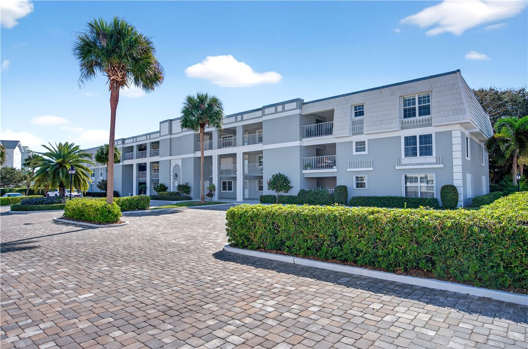 2743 Ocean Drive, Unit 50E Vero Beach, FL 32963 - Photo 5 of 36 a view of a building with a garden