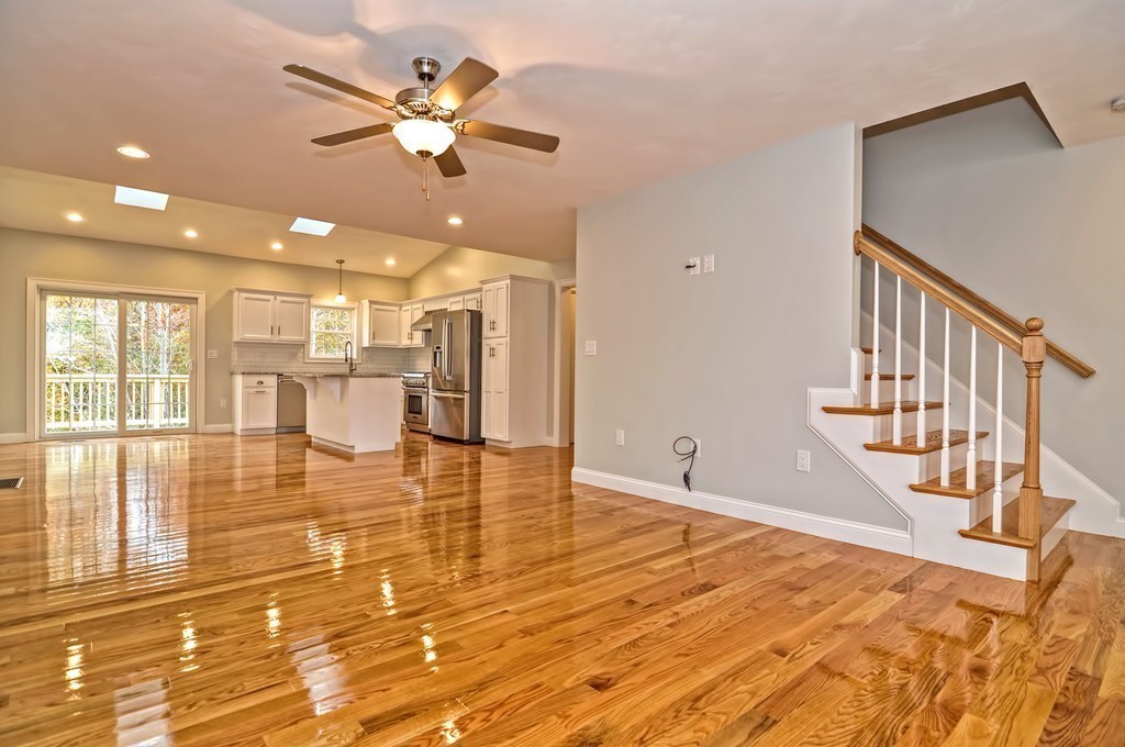 87 Ariel Circle Sutton, MA 01590 - Photo 11 of 30 a view of a kitchen with furniture and a floor to ceiling window