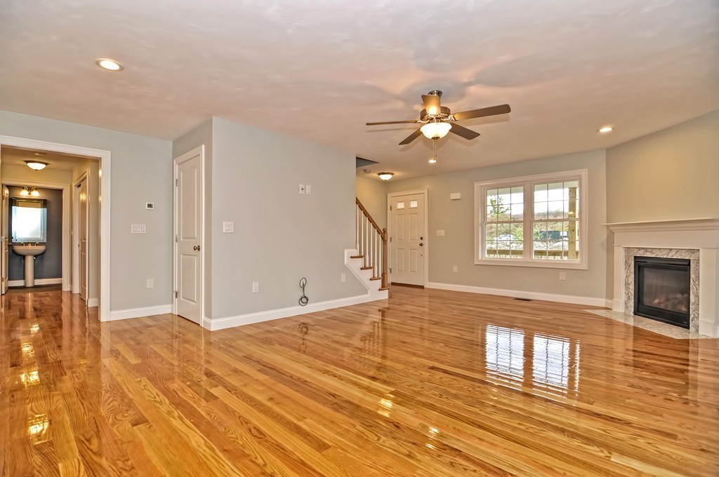 87 Ariel Circle Sutton, MA 01590 - Photo 13 of 30 a view of an empty room with window and wooden floor