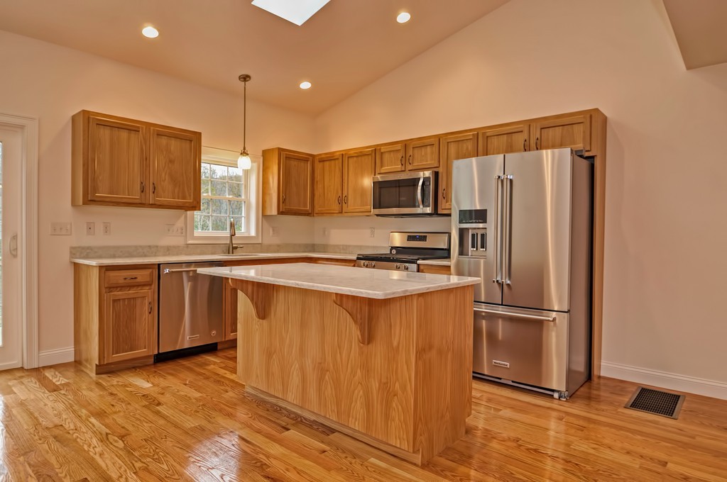 87 Ariel Circle Sutton, MA 01590 - Photo 15 of 30 a kitchen with stainless steel appliances a refrigerator sink and microwave