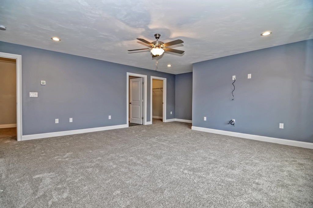 87 Ariel Circle Sutton, MA 01590 - Photo 19 of 30 a view of a livingroom with a ceiling fan and window