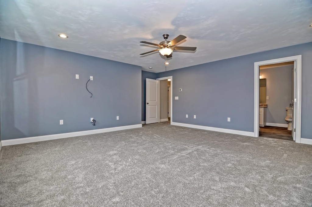 87 Ariel Circle Sutton, MA 01590 - Photo 20 of 30 a view of an empty room with a ceiling fan
