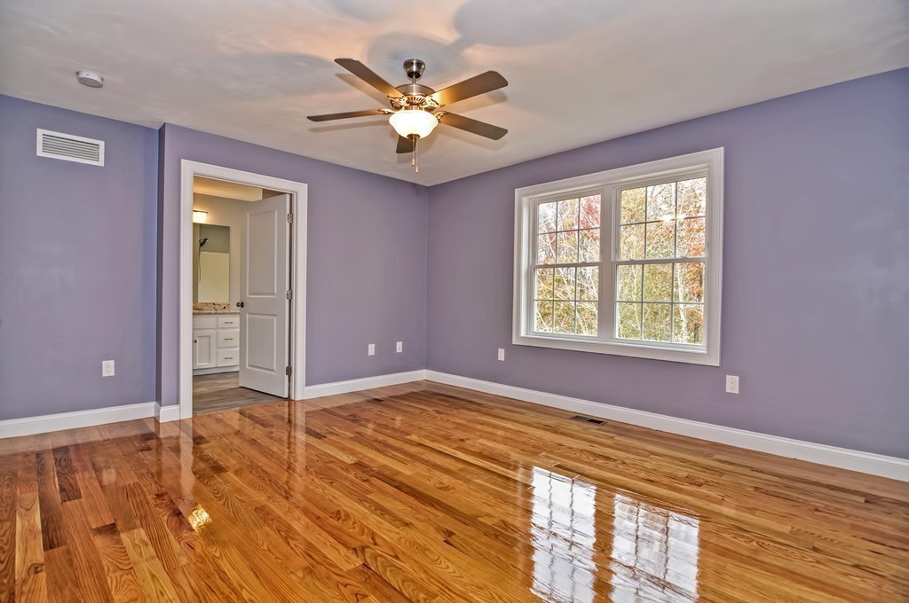 87 Ariel Circle Sutton, MA 01590 - Photo 22 of 30 a view of an empty room with wooden floor and a window