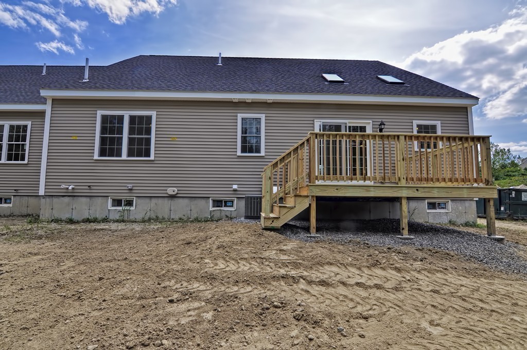 87 Ariel Circle Sutton, MA 01590 - Photo 28 of 30 a front view of a house with a yard