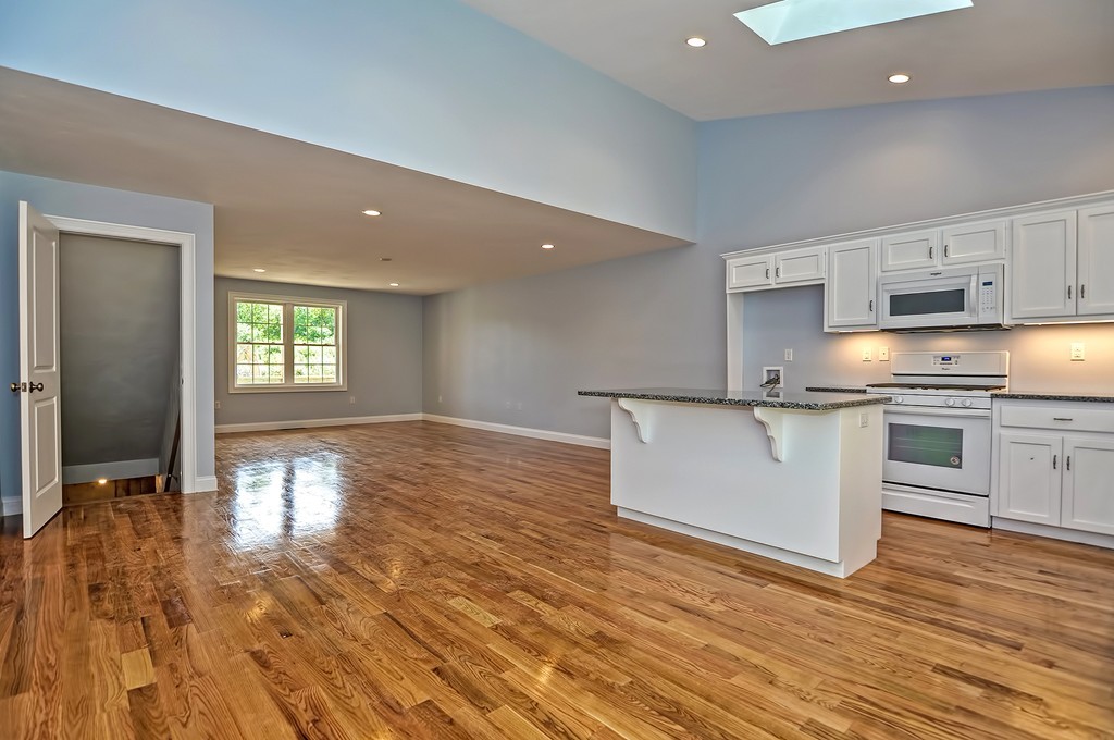 87 Ariel Circle Sutton, MA 01590 - Photo 5 of 30 a view of a kitchen with wooden floor
