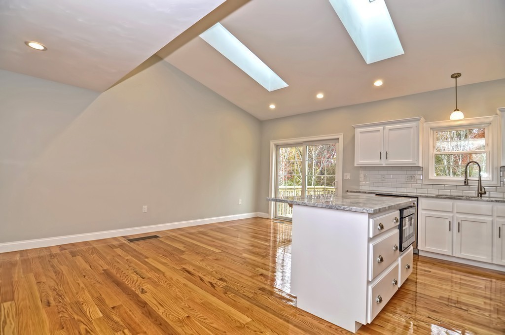 87 Ariel Circle Sutton, MA 01590 - Photo 8 of 30 a kitchen with a sink window and cabinets