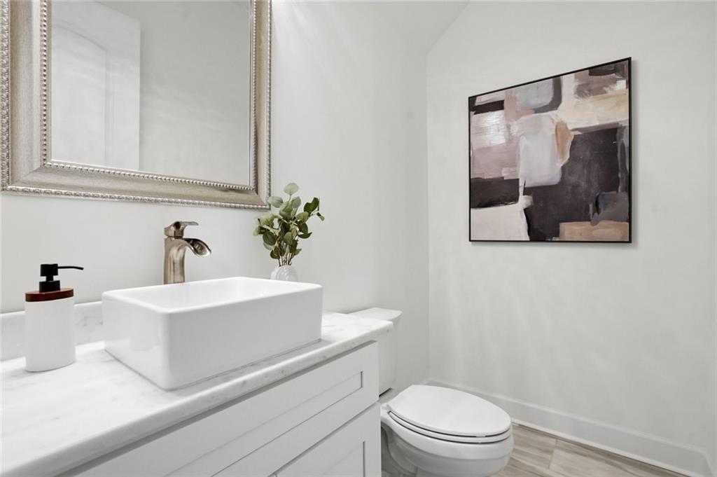 2415 West Rugby Avenue Atlanta, GA 30337 - Photo 28 of 40 a bathroom with a sink and a mirror